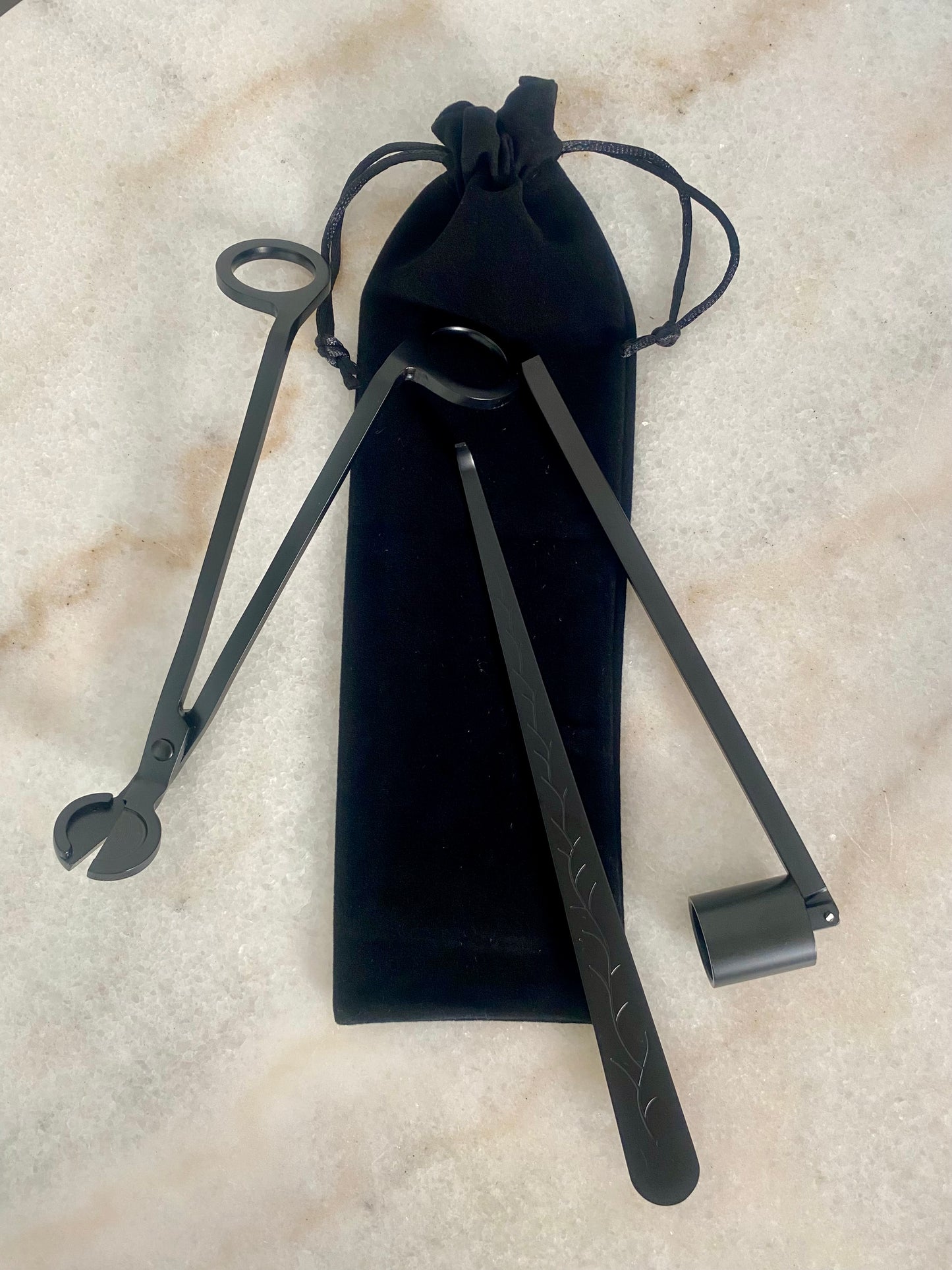 Black metal tool set on a textured beige surface including wick trimmer, candle snuffer and dipper.
Candle essentials, candle accessories,
must-have for every true candle lover - designed to enhance the longevity, beauty and ritual pf your candle.
LUNA DECO