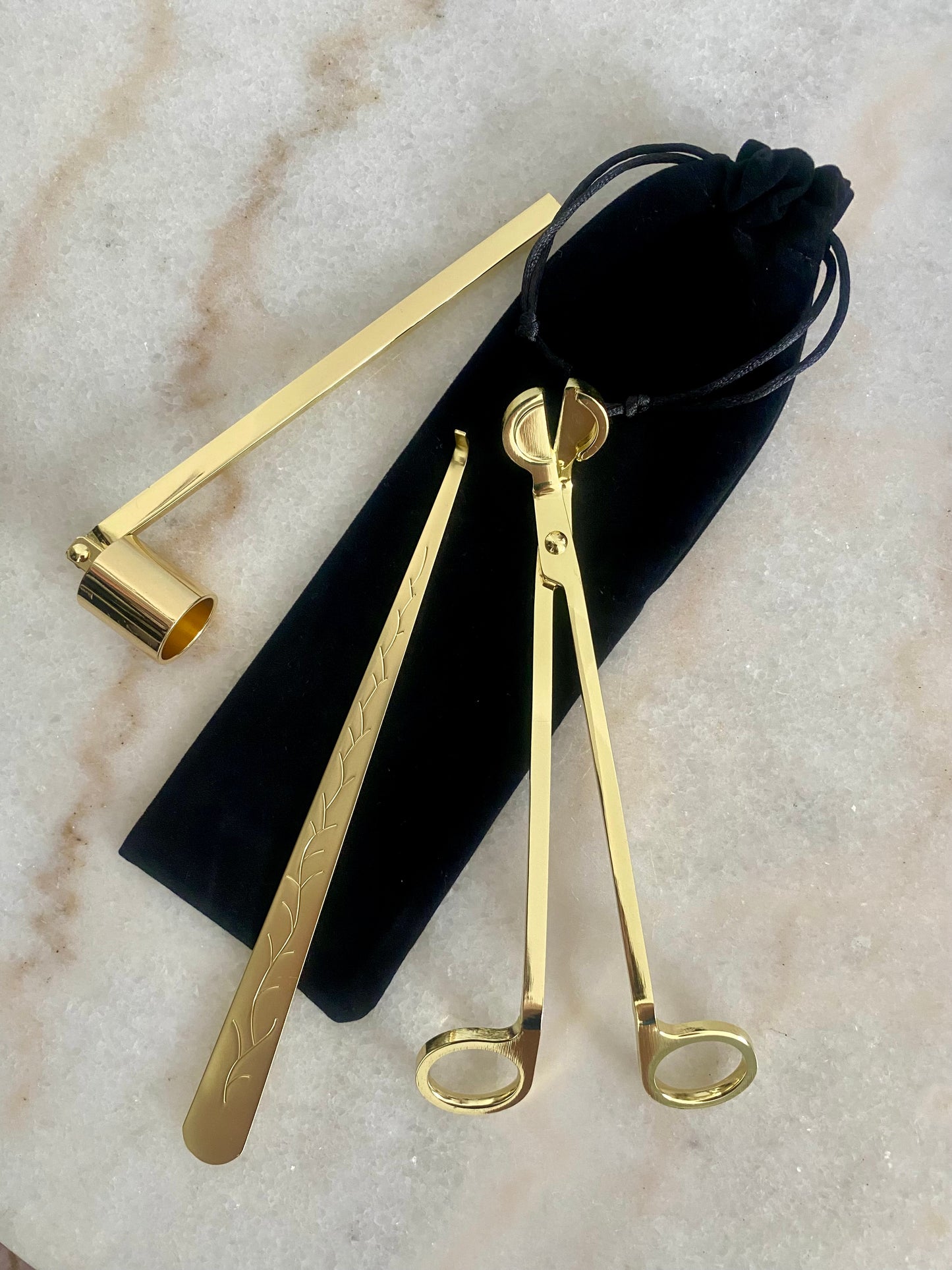 Set of gold candle care set - wick trimmer, candle snuffer and dipper on a marble surface with a black velvet pouch.
Candle essentials, candle accessories,
must-have for every true candle lover - designed to enhance the longevity, beauty and ritual pf your candle.
Luna Deco