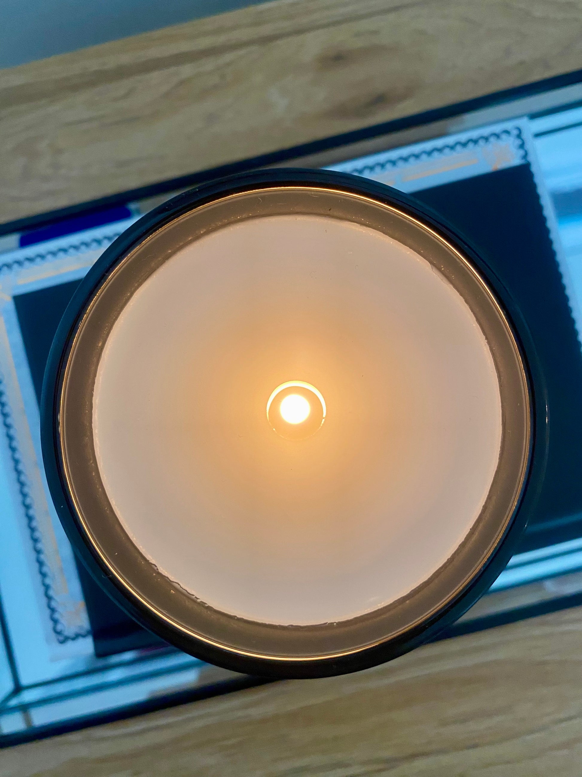 Close-up of a lit candle.
Black matte candle on coffee table book.
Home decor ideas, minimalist style, Australian made soy candle, cozy home, home fragrance, calm and relax, hand-poured soy candles,clean and fresh burn, perfect gift, treat to yourself, stunning decoration piece, 
