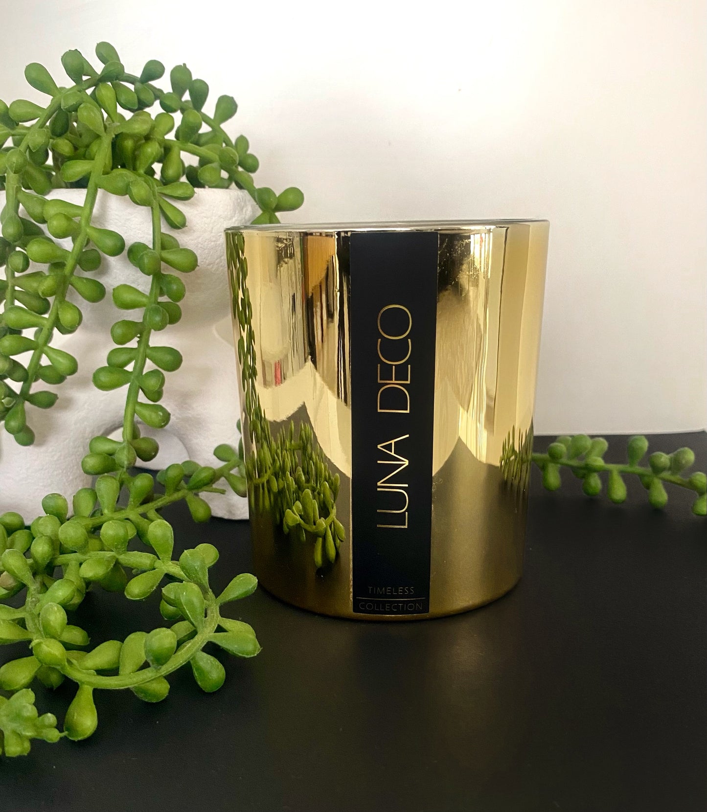 Gold candle with 'LUNA DECO' branding on a black surface with green plants.
Home decor ideas, minimalist style, Australian made soy candle, cozy home, home fragrance, calm and relax, hand-poured soy candles, clean and fresh burn, perfect gift, treat to yourself, stunning decoration piece, 